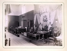 Два стенда с мебелью 19 века.